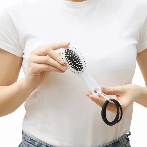 Brosse de voyage avec élastiques à cheveux COIFFEUR